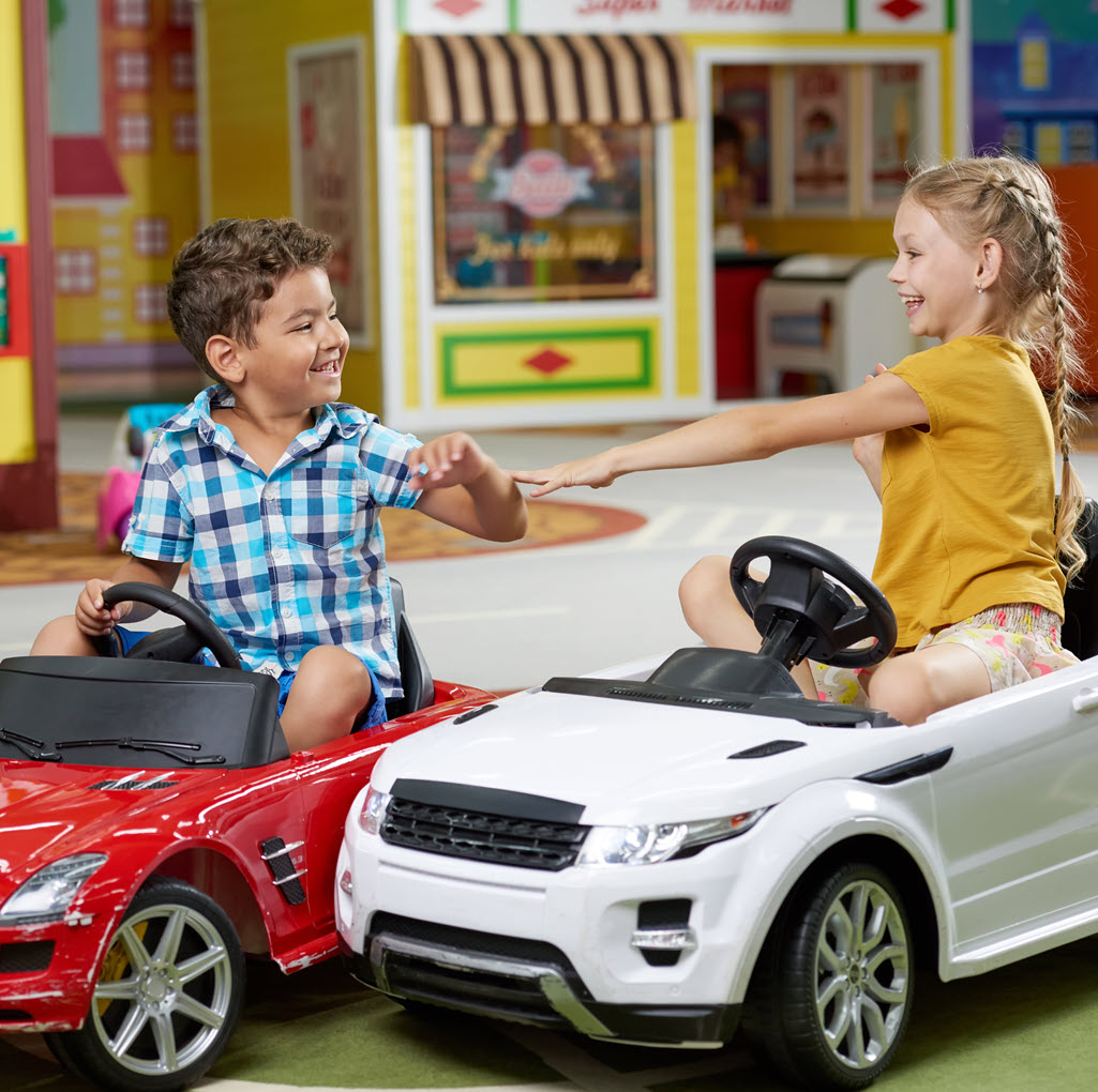 children playing in role play village